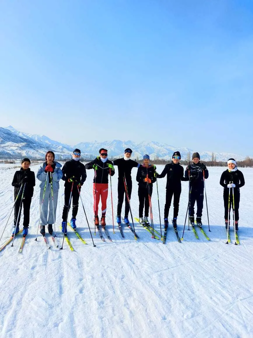 Kyrgyz biathletes on skis at a winter training session in Tash-Debe